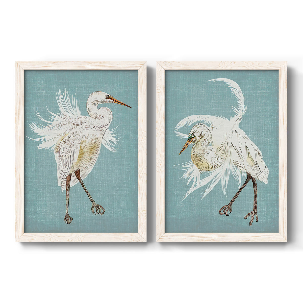 Set of two white barnwood framed canvas prints featuring two decorative bird illustrations featuring white herons displaying long windswept feathers.