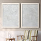 Set of two white barnwood framed canvas prints depicting two textural monochrome abstracts featuring overlapping white carved arcs and ridges above a sideboard in a cozy sitting room.