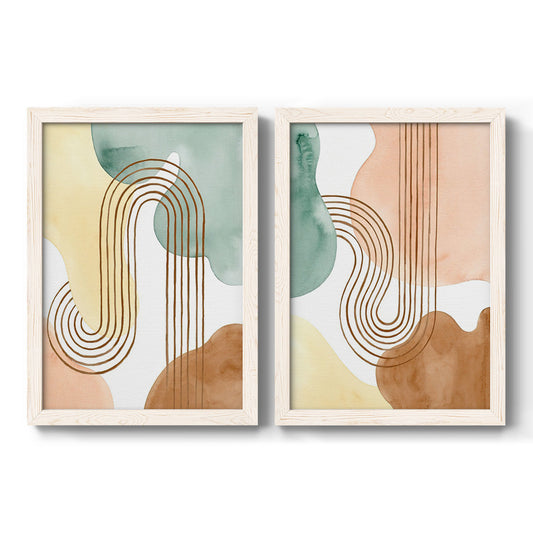 Set of two white barnwood framed canvas prints featuring two folk-inspired botanical patterns featuring repeating indigo floral and leaf motifs.