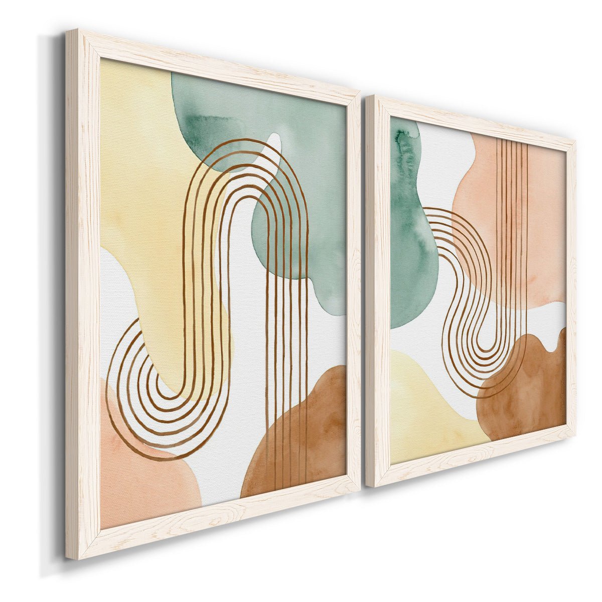 Angled view of a set of two white barnwood framed canvas prints featuring two folk-inspired botanical patterns featuring repeating indigo floral and leaf motifs.