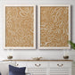 Set of two white barnwood framed canvas prints depicting a coordinated art pair of continuous white organic lines over solid ochre and blush fields rendered as graphic botanical pattern abstracts above a dining room sideboard.