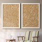Set of two white barnwood framed canvas prints depicting two graphic botanical pattern abstracts featuring continuous white organic lines over solid ochre and blush fields above a sideboard in a cozy sitting room.