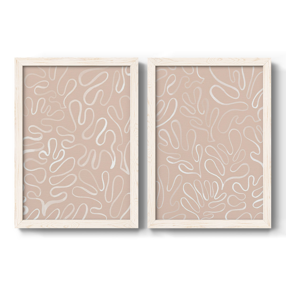 Set of two white barnwood framed canvas prints featuring two graphic botanical pattern abstracts featuring continuous white organic lines over solid ochre and blush fields.