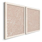 Angled view of a set of two white barnwood framed canvas prints featuring two graphic botanical pattern abstracts featuring continuous white organic lines over solid ochre and blush fields.