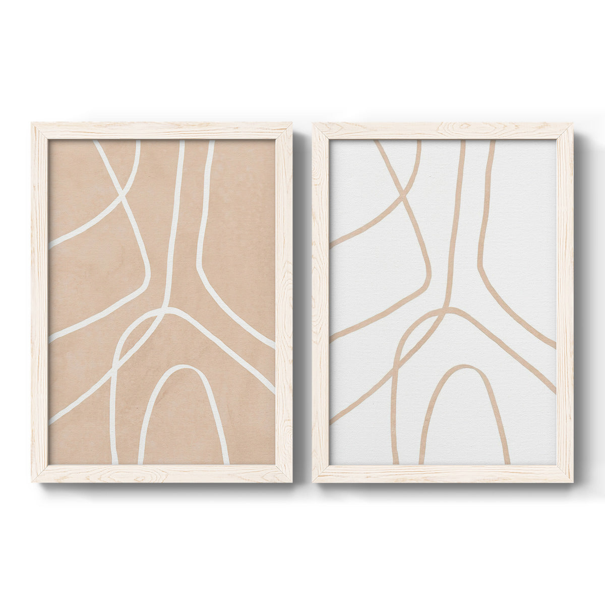 Set of two white barnwood framed canvas prints featuring two minimalist line abstracts featuring single continuous tan lines forming oversized organic curves.