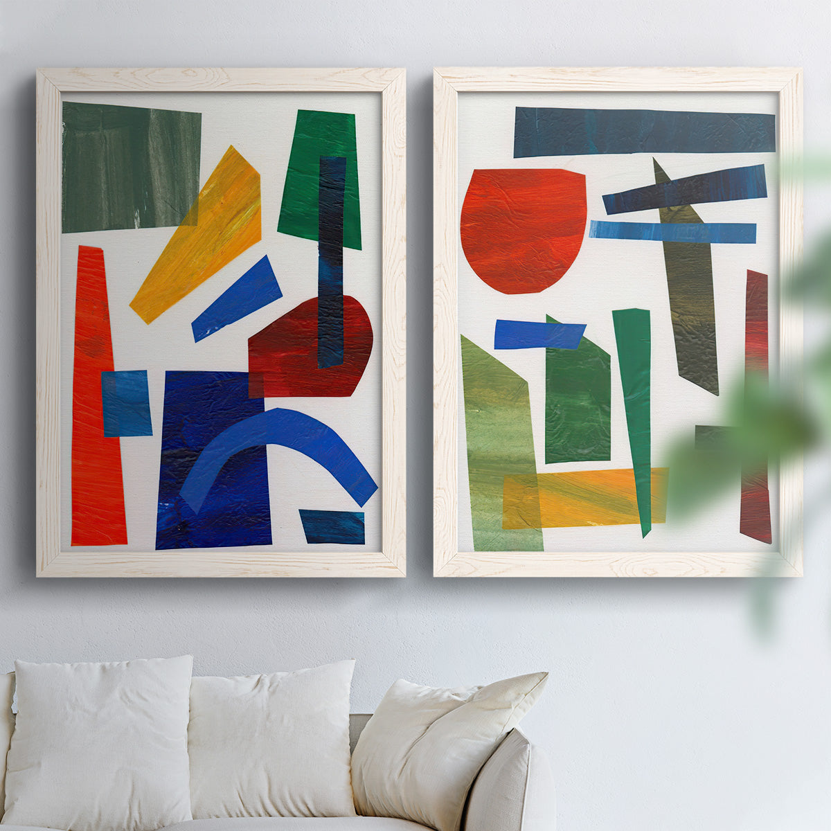Set of two white barnwood framed canvas prints depicting flat rectangles arcs and angled bars on cream grounds arranged across two complementary compositions above a sofa in a bright living space.