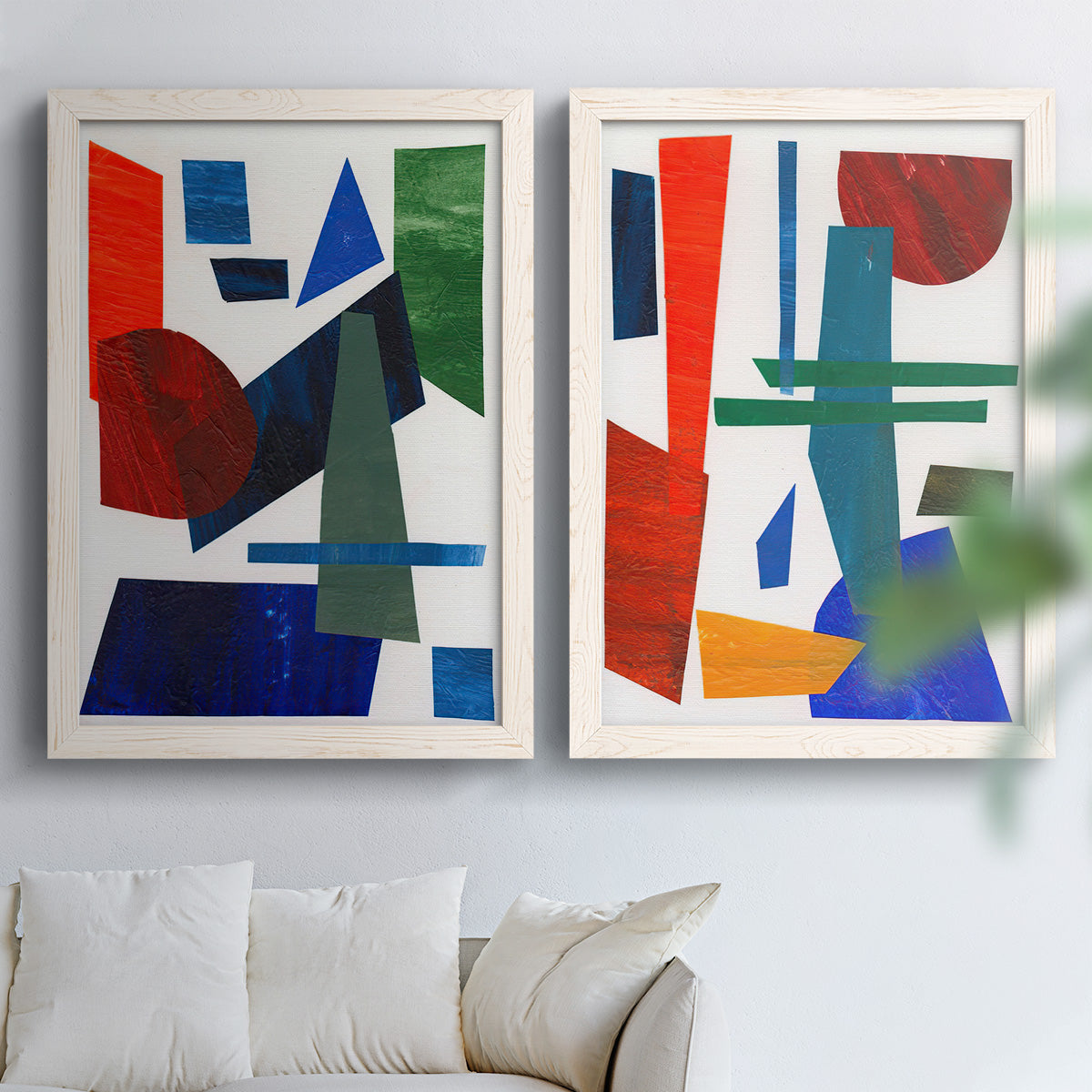 Set of two white barnwood framed canvas prints depicting flat rectangles arcs and angled bars on cream grounds arranged across two complementary compositions above a sofa in a bright living space.