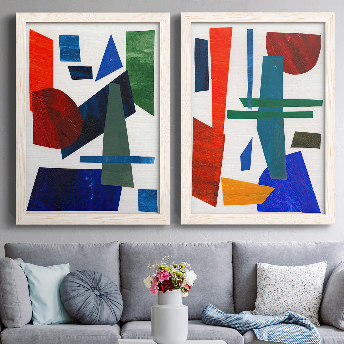 Set of two white barnwood framed canvas prints depicting paired mid-century graphic abstracts with flat rectangles arcs and angled bars on cream grounds above a sofa in a contemporary living room.
