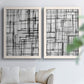 Set of two white barnwood framed canvas prints depicting overlapping rectangles, hand-drawn verticals, and transparent gray intersections arranged across two complementary compositions above a sofa in a bright living space.