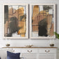 Set of two white barnwood framed canvas prints depicting a coordinated art pair of earthy watercolor blocks crossed by black contour lines rendered as retro geometric abstracts above a dining room sideboard.