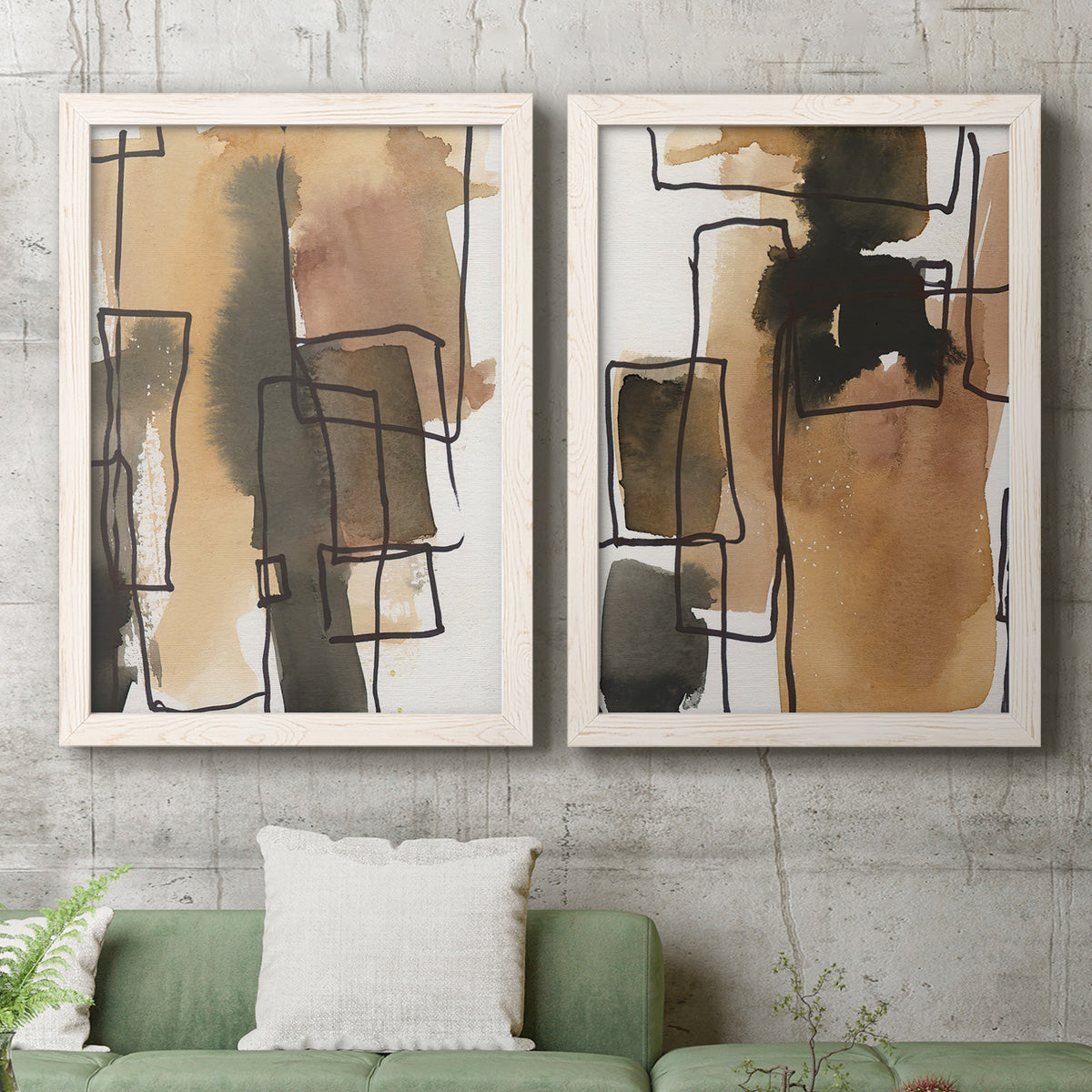 Set of two white barnwood framed canvas prints depicting a coordinated art pair of earthy watercolor blocks crossed by black contour lines rendered as retro geometric abstracts above a sofa in a modern living room.