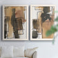 Set of two white barnwood framed canvas prints depicting tan brown gray and cream shapes with loose rectangular structure arranged across two complementary compositions above a sofa in a bright living space.