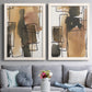 Set of two white barnwood framed canvas prints depicting paired retro geometric abstracts with tan brown gray and cream shapes with loose rectangular structure above a sofa in a contemporary living room.