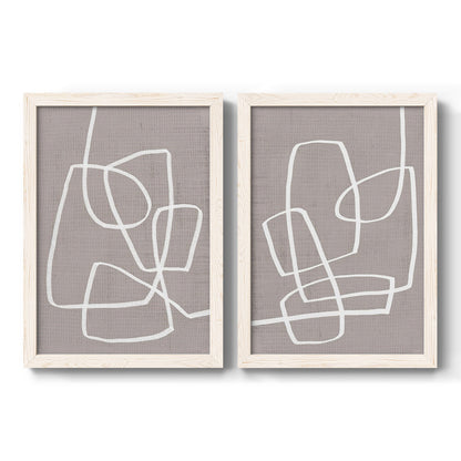 Set of two white barnwood framed canvas prints featuring two minimalist geometric line art featuring overlapping white continuous-line loops on taupe.