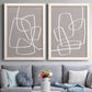 Set of two white barnwood framed canvas prints depicting paired minimalist geometric line art with rounded rectangular contours, soft gray grounds, and sparse composition above a sofa in a contemporary living room.