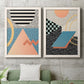 Set of two white barnwood framed canvas prints depicting a coordinated art pair of bold geometric Memphis-style patterns rendered as retro graphic abstracts above a sofa in a modern living room.