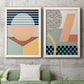 Set of two white barnwood framed canvas prints depicting a coordinated art pair of bold geometric Memphis-style patterns rendered as retro graphic abstracts above a sofa in a modern living room.
