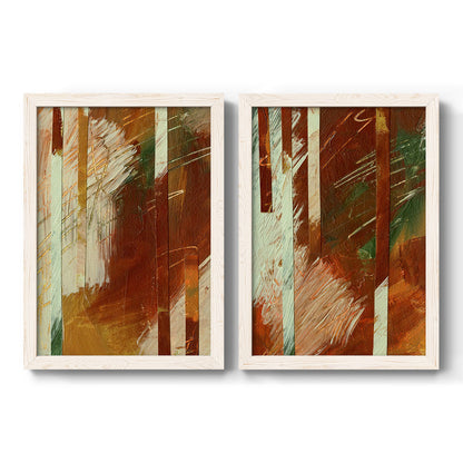 Set of two white barnwood framed canvas prints featuring two earthy modern abstracts featuring rust orange black cream and green brush bands.
