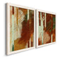 Angled view of a set of two white barnwood framed canvas prints featuring two earthy modern abstracts featuring rust orange black cream and green brush bands.