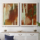 Set of two white barnwood framed canvas prints depicting a coordinated art pair of rust orange black cream and green brush bands rendered as earthy modern abstracts above a dining room sideboard.
