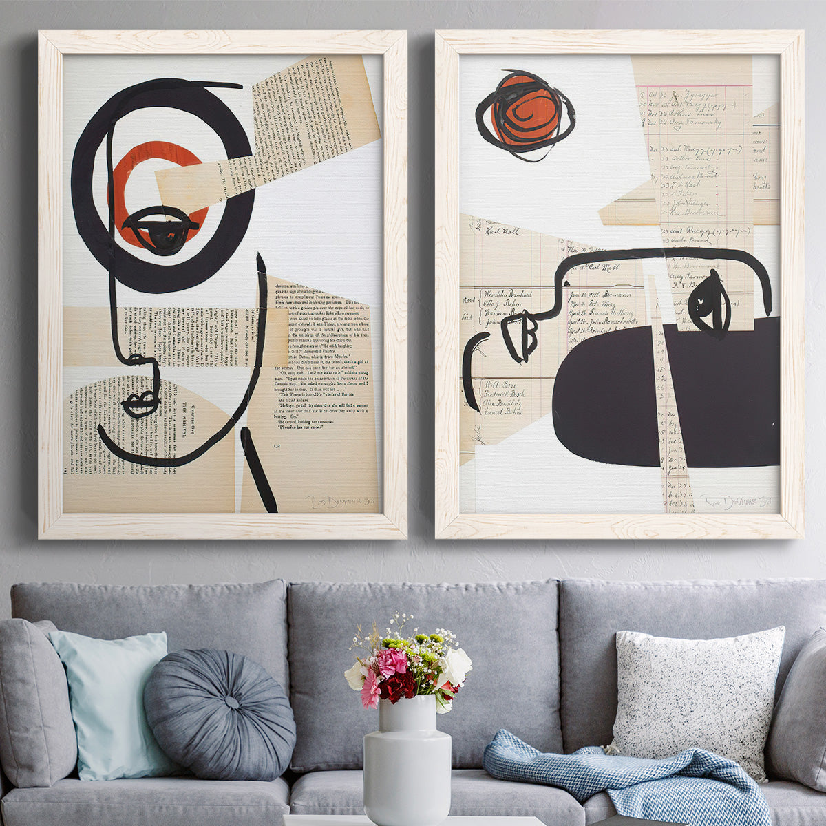 Set of two white barnwood framed canvas prints depicting paired mixed-media portrait collages with black contour features, red blocks, typography, and torn-paper textures above a sofa in a contemporary living room.