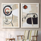 Set of two white barnwood framed canvas prints depicting two mixed-media portrait collages featuring cubist faces layered over vintage book pages above a sideboard in a cozy sitting room.
