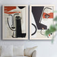 Set of two white barnwood framed canvas prints depicting black contour features, red blocks, typography, and torn-paper textures arranged across two complementary compositions above a sofa in a bright living space.