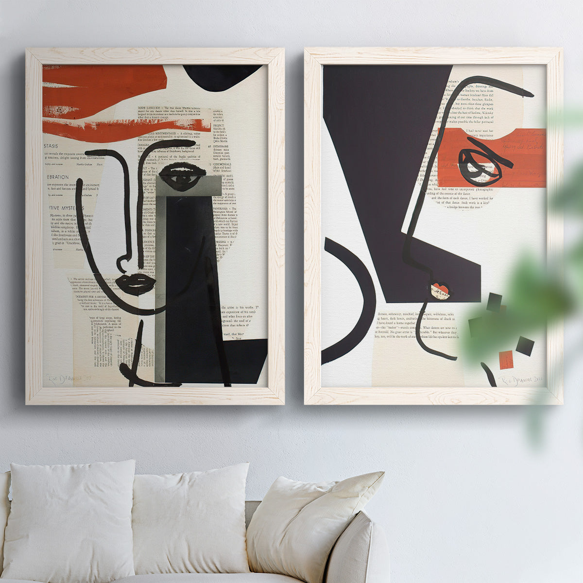 Set of two white barnwood framed canvas prints depicting black contour features, red blocks, typography, and torn-paper textures arranged across two complementary compositions above a sofa in a bright living space.