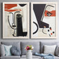 Set of two white barnwood framed canvas prints depicting paired mixed-media portrait collages with black contour features, red blocks, typography, and torn-paper textures above a sofa in a contemporary living room.