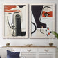 Set of two white barnwood framed canvas prints depicting a coordinated art pair of cubist faces layered over vintage book pages rendered as mixed-media portrait collages above a dining room sideboard.