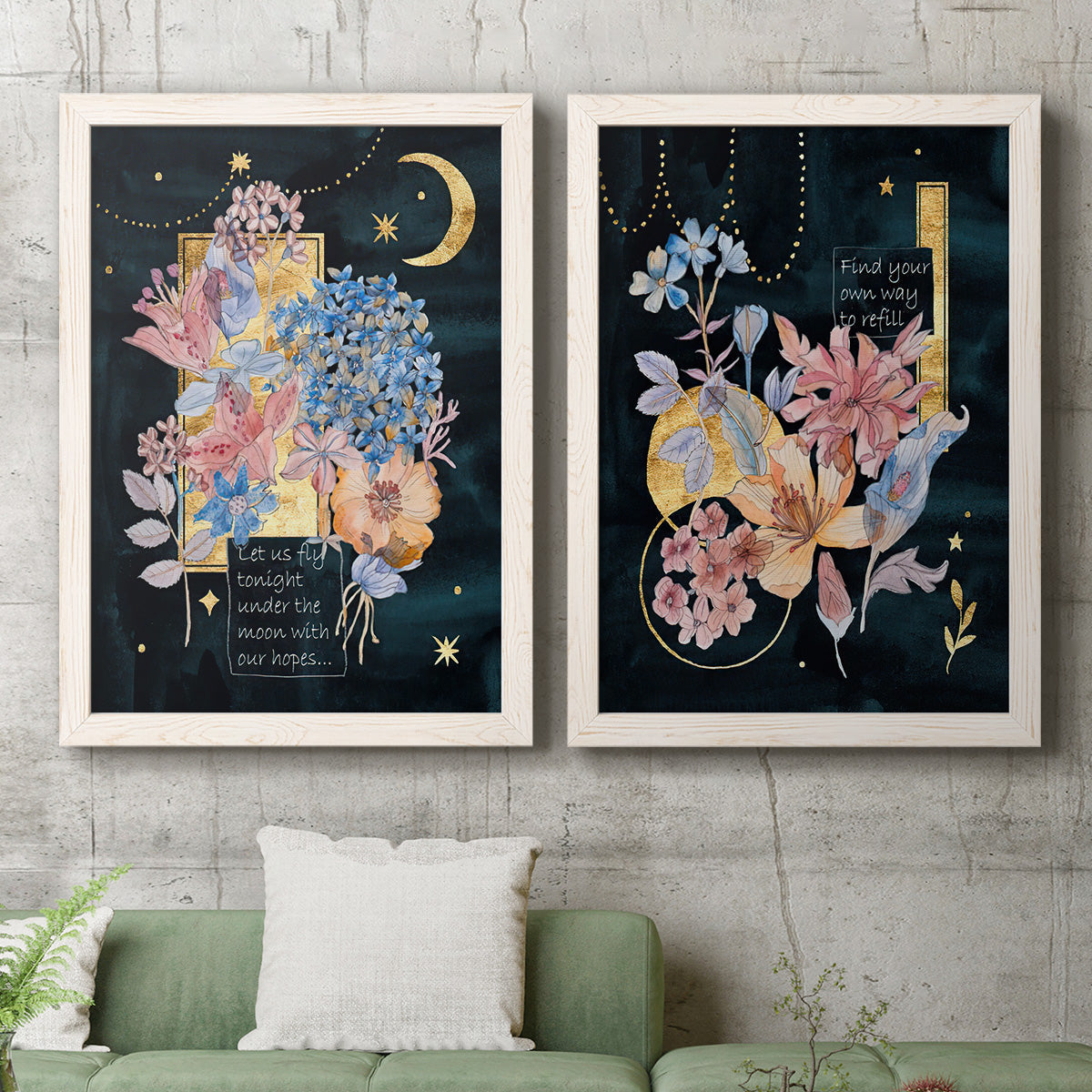 Set of two white barnwood framed canvas prints depicting a coordinated art pair of fantastical bouquets and celestial symbols on black rendered as whimsical floral collages above a sofa in a modern living room.