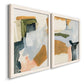 Angled view of a set of two white barnwood framed canvas prints featuring two contemporary mixed-media abstracts featuring layered green ochre blush gray and white paint blocks.
