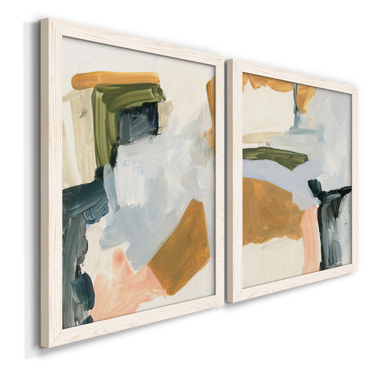 Angled view of a set of two white barnwood framed canvas prints featuring two contemporary mixed-media abstracts featuring layered green ochre blush gray and white paint blocks.