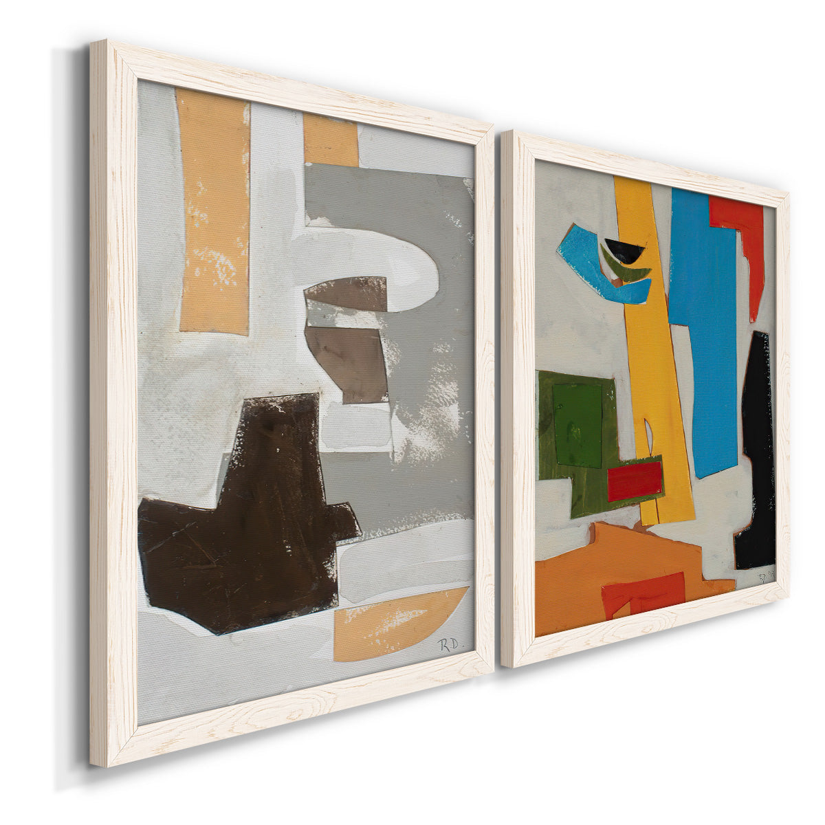 Angled view of a set of two white barnwood framed canvas prints featuring two mid-century geometric abstracts featuring stacked gray cream blue and bright geometric blocks.