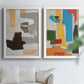 Set of two white barnwood framed canvas prints depicting rectangles arcs and angular sections with bold color contrasts arranged across two complementary compositions above a sofa in a bright living space.