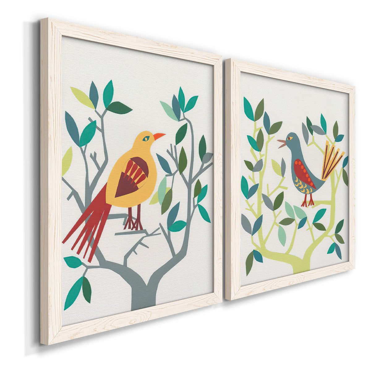 Angled view of a set of two white barnwood framed canvas prints featuring two modern folk-art bird illustrations featuring stylized colorful birds perched among leafy branches.