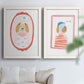 Set of two white barnwood framed canvas prints depicting striped outfits, eyeglasses, decorative borders, and pastel accents arranged across two complementary compositions above a sofa in a bright living space.
