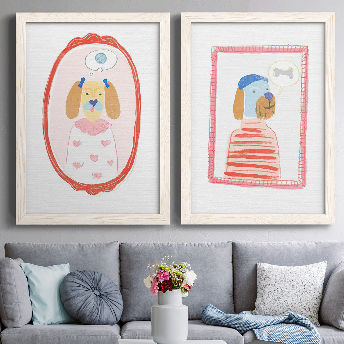 Set of two white barnwood framed canvas prints depicting paired whimsical nursery illustrations with striped outfits, eyeglasses, decorative borders, and pastel accents above a sofa in a contemporary living room.