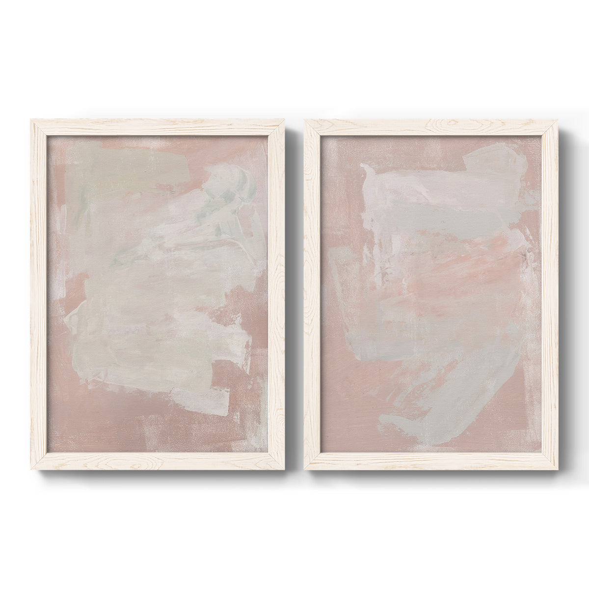 Set of two white barnwood framed canvas prints featuring two minimalist color-field abstracts featuring soft blush and white painterly fields.