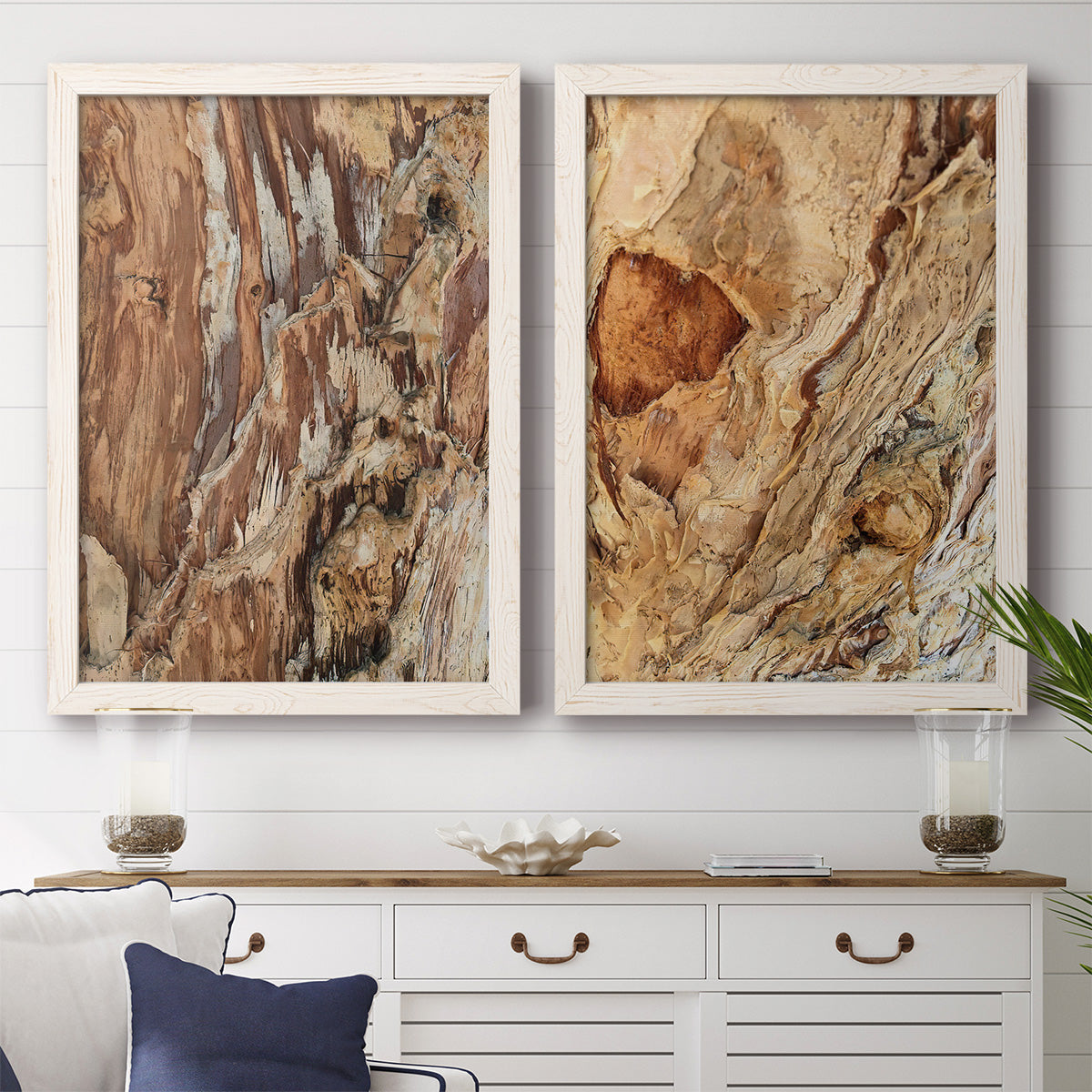 Set of two white barnwood framed canvas prints depicting a coordinated art pair of close-up tree bark textures rendered as rustic nature photography above a dining room sideboard.