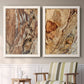 Set of two white barnwood framed canvas prints depicting two rustic nature photography featuring close-up tree bark textures above a sideboard in a cozy sitting room.