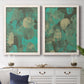 Set of two white barnwood framed canvas prints depicting a coordinated art pair of layered mint teal and beige circular forms rendered as textured organic abstracts above a dining room sideboard.