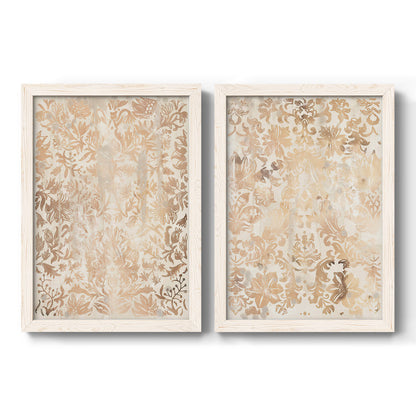 Set of two white barnwood framed canvas prints featuring two vintage decorative prints featuring ornate cream floral damask patterns.