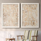 Set of two white barnwood framed canvas prints depicting two vintage decorative prints featuring ornate cream floral damask patterns above a sideboard in a cozy sitting room.