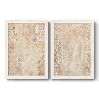 Set of two white barnwood framed canvas prints featuring two vintage decorative prints featuring ornate cream floral damask patterns.