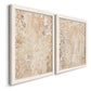 Angled view of a set of two white barnwood framed canvas prints featuring two vintage decorative prints featuring ornate cream floral damask patterns.