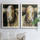 Set of two white barnwood framed canvas prints depicting large expressive eyes, warm brown faces, and dark backgrounds arranged across two complementary compositions above a sofa in a bright living space.