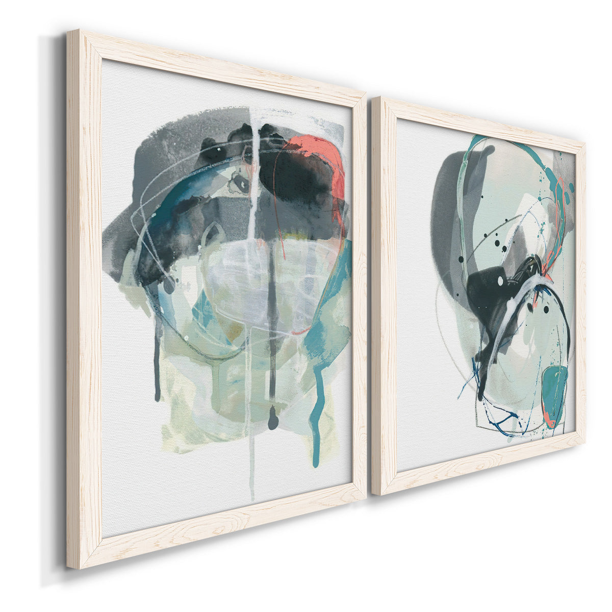 Angled view of a set of two white barnwood framed canvas prints featuring two bold gestural abstracts featuring large black gray and teal circular gestures.