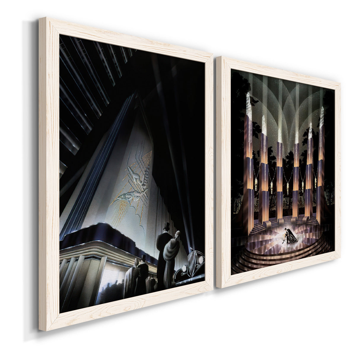 Angled view of a set of two white barnwood framed canvas prints featuring two vintage architectural illustrations featuring dramatic Art Deco city and theater scenes.
