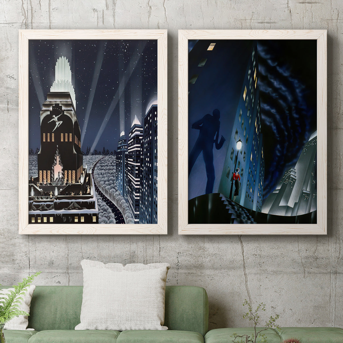 Set of two white barnwood framed canvas prints depicting a vintage urban pair of towering architecture searchlights stars and shadowed people at night above a sofa in a modern living room.